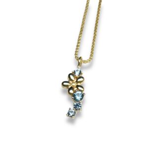 Collier petite fleur topazes bleues sur or jaune 18 carats 750/000 ème