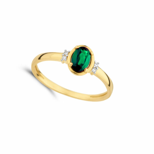 Bague émeraude ovale et diamants épaulée sur or jaune 18 carats