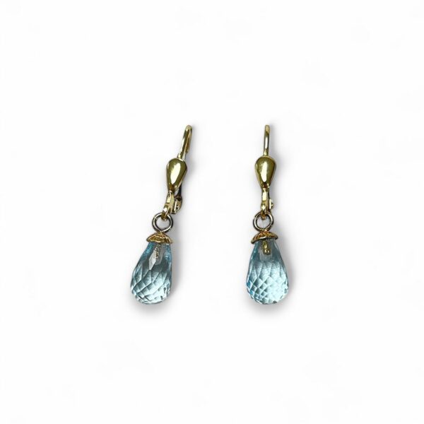 Bijoux d'oreilles dormeuses topazes bleues facettées or jaune 18 carats